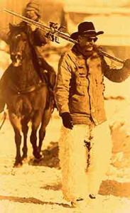 Cowboy Carrying Skis in sepia | Writer Mariecor | WriterMariecor.com