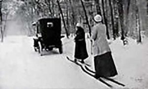 Vintage photo of two females skijoring via automobile | Writer Mariecor | WriterMariecor.com