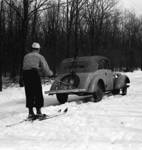 Vintage photo of Skijoring via automobile | Writer Mariecor | WriterMariecor.com