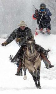 Skijoring Team of Cowboy and Skier during snowfall | Writer Mariecor | WriterMariecor.com